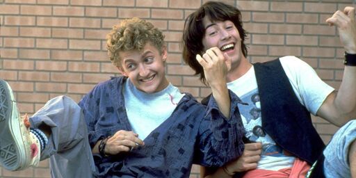 Bill and Ted from "Bill and Ted's Excellent Adventure" playing an enthusiastic empty-handed lick of air guitar.