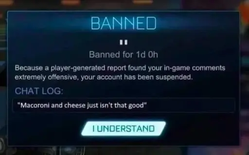 A screen capture of a game warning a player their account was banned. The text reads: 'BANNED. Banned for 1d 0h. Becaues a player-generated report found your in-game comments extremely offensive, your account has been suspended. CHAT LOG has been edited to read: "Macoroni [sic] and cheese just isn't that good". A button reads 'I understand'.